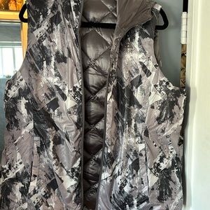 reversible women's hooded, quilted vest. Size large side pockets.